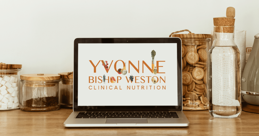 Yvonne Bishop Weston clinical nutrition logo on a laptop in a kitchen